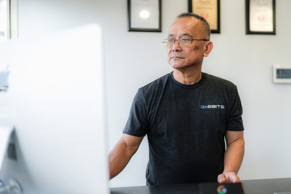 Certified technician repairing phones and computers for Seattle and Bellevue customers